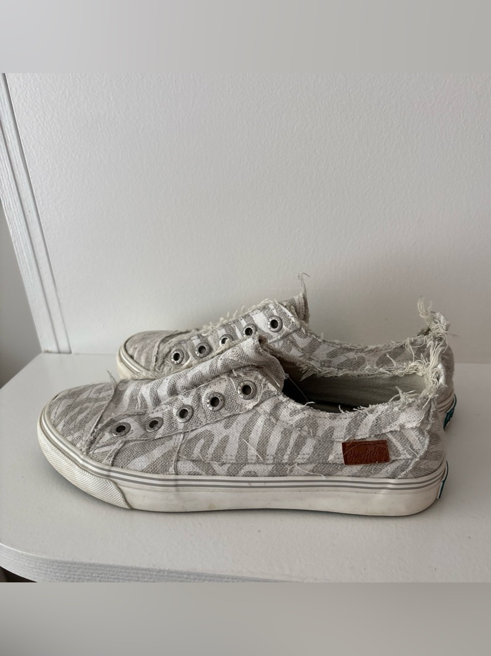 Blowfish Distressed Slip-On Zebra Print Sneakers in Light Gray and White